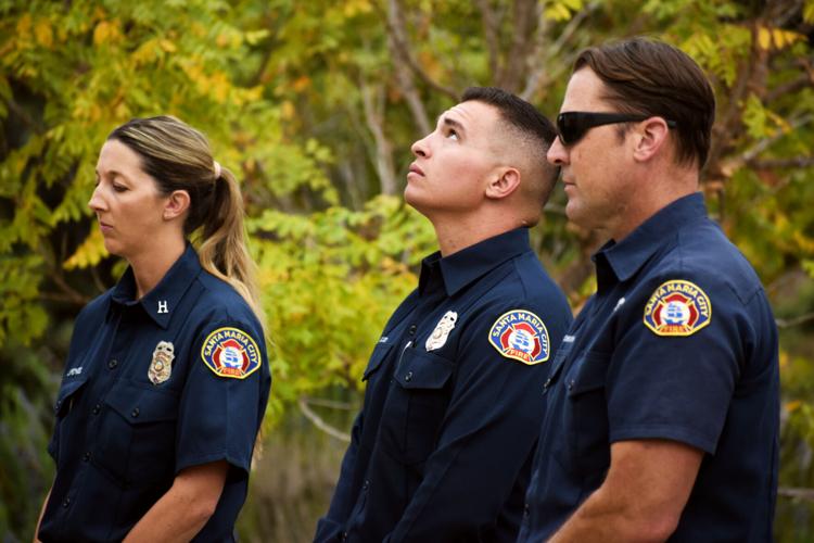 Santa Maria Fire Captain Jill Pontes, Engineer Andy Downhower and Firefighter Kevin Good gather at station 3 to commemorate the 9/11 Sunday morning.