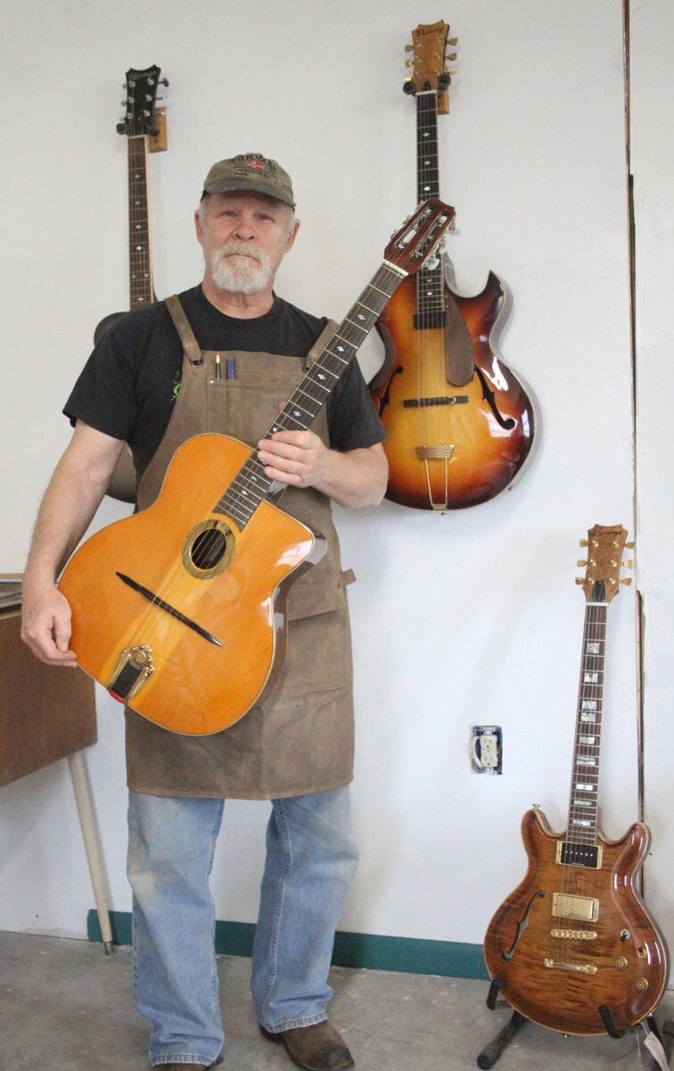 MUSICALLY INCLINED Locals share love of guitars for International