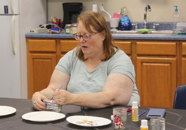 Julie Poor demonstrates how to create mason jar tea lights