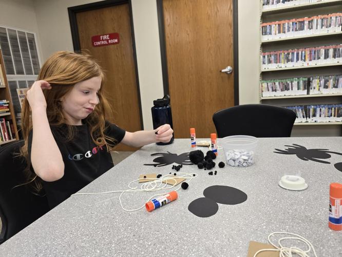 CLIMBING SPIDERS Hulbert library has children practicing art