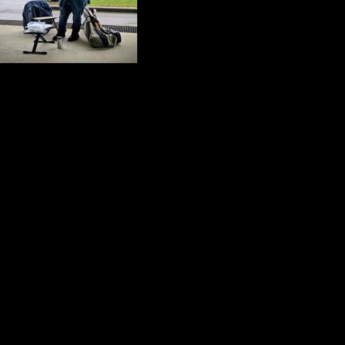 BASKING IN BUSKING: Musicians play for tips, enjoy interaction with public