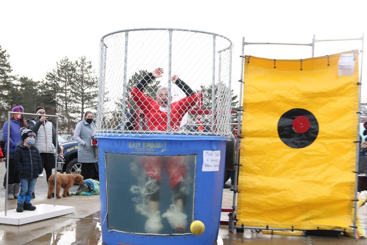 Teachers brave the dunk tank on Disability Awareness Day to raise money for  senior heading for the Special Olympics World Games – AAPS District News