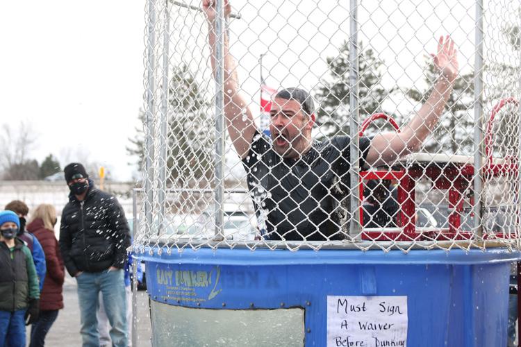 Teachers brave the dunk tank on Disability Awareness Day to raise money for  senior heading for the Special Olympics World Games – AAPS District News