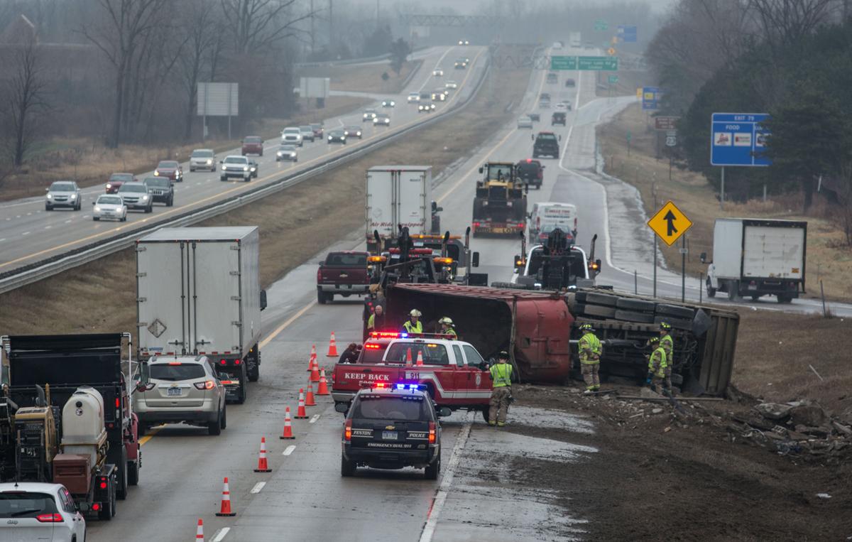 The Fenton Fire Department respond to three separate crashes Wednesday afternoon on U.S. 23 near Owen Road in Fenton. This tractor/trailer severely jack-knifed after the driver lost control, possibly slowing down in the rain to avoid another crash up ahead. The driver was treated for minor injuries.