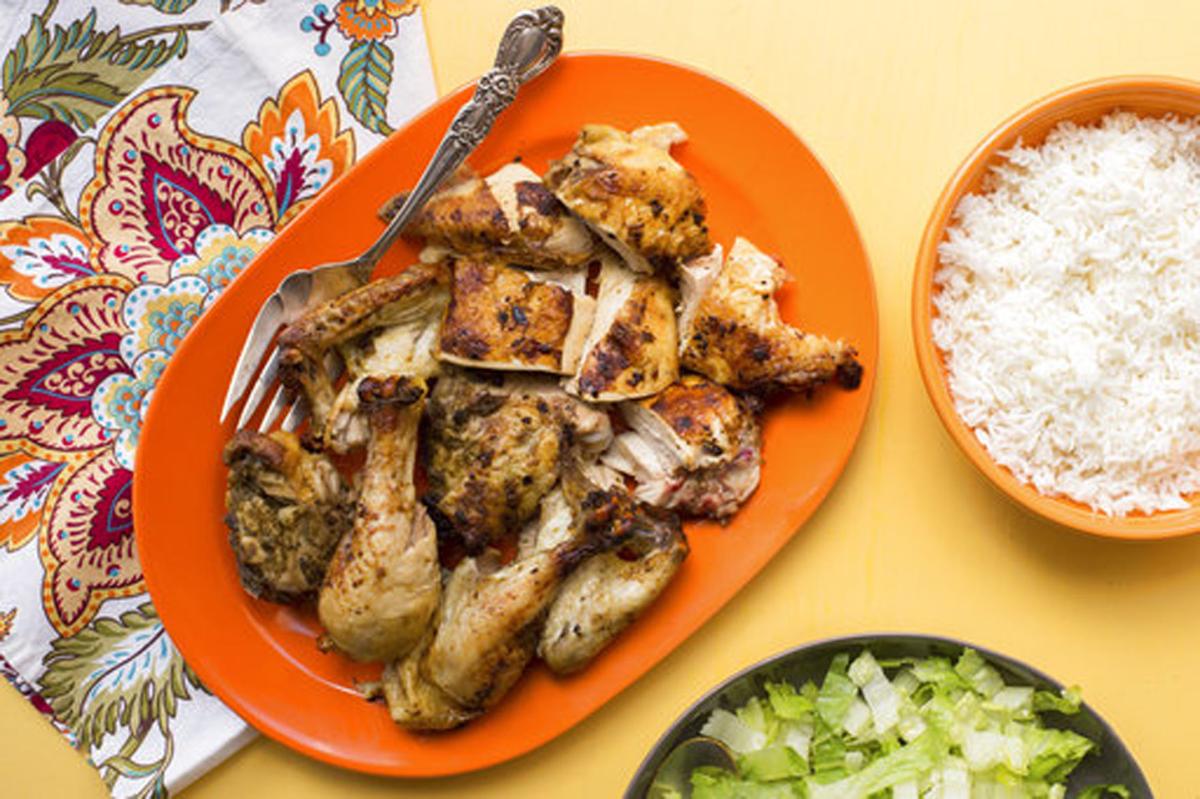 Serve piri piri chicken with rice, salad and beer Food