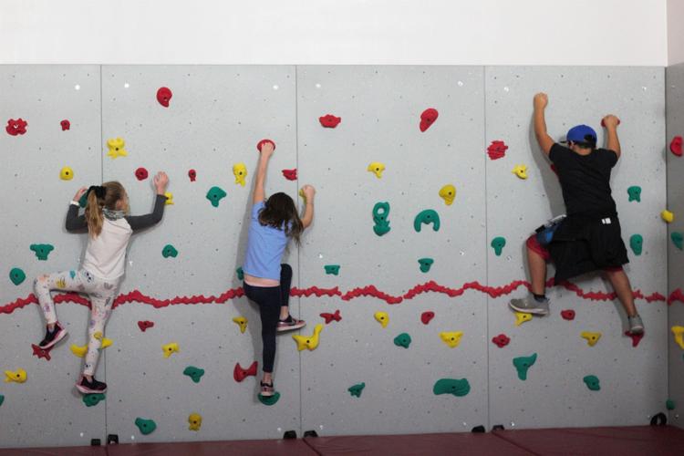 YMCA opens new family zone with climbing wall and teen center