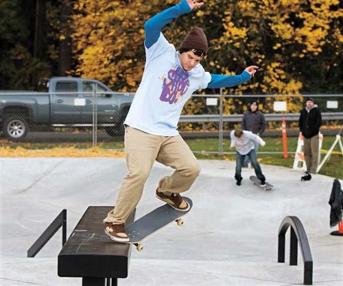 Skater Girl Grinding on a Ledge in a Skatepark. Feet of Aggressive