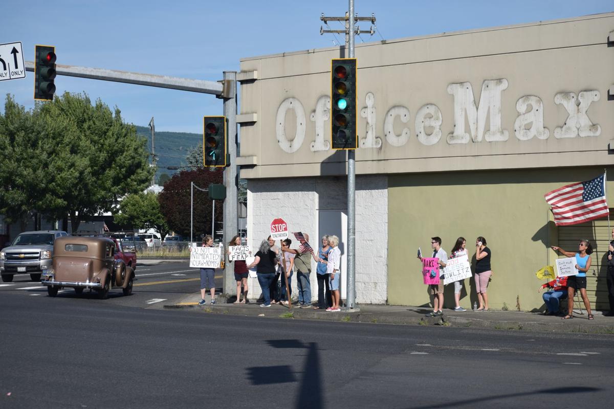 Demonstrators by old Office Max building