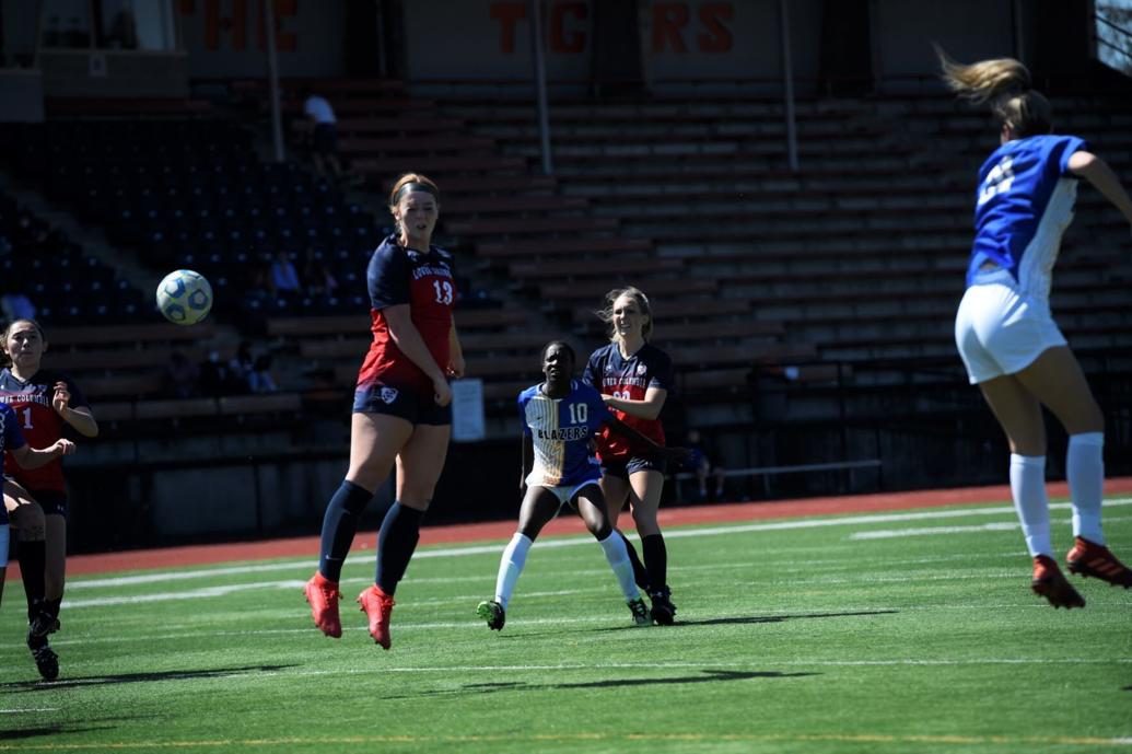 Julia Cash header for LCC soccer