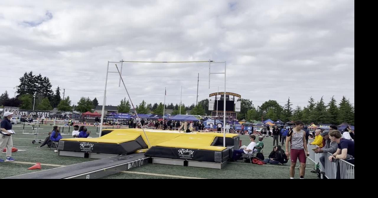 Woodland's Mason Thomas performs a pole vault at state