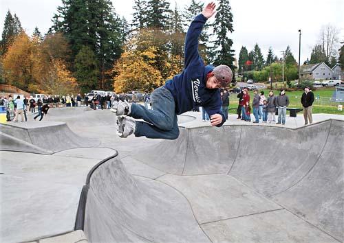 Skater Girl Grinding on a Ledge in a Skatepark. Feet of Aggressive