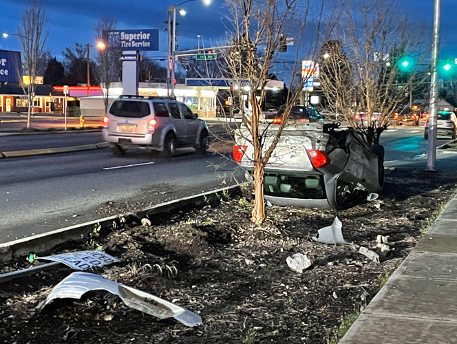 Driver walks away after car flips on Tennant Way in Longview