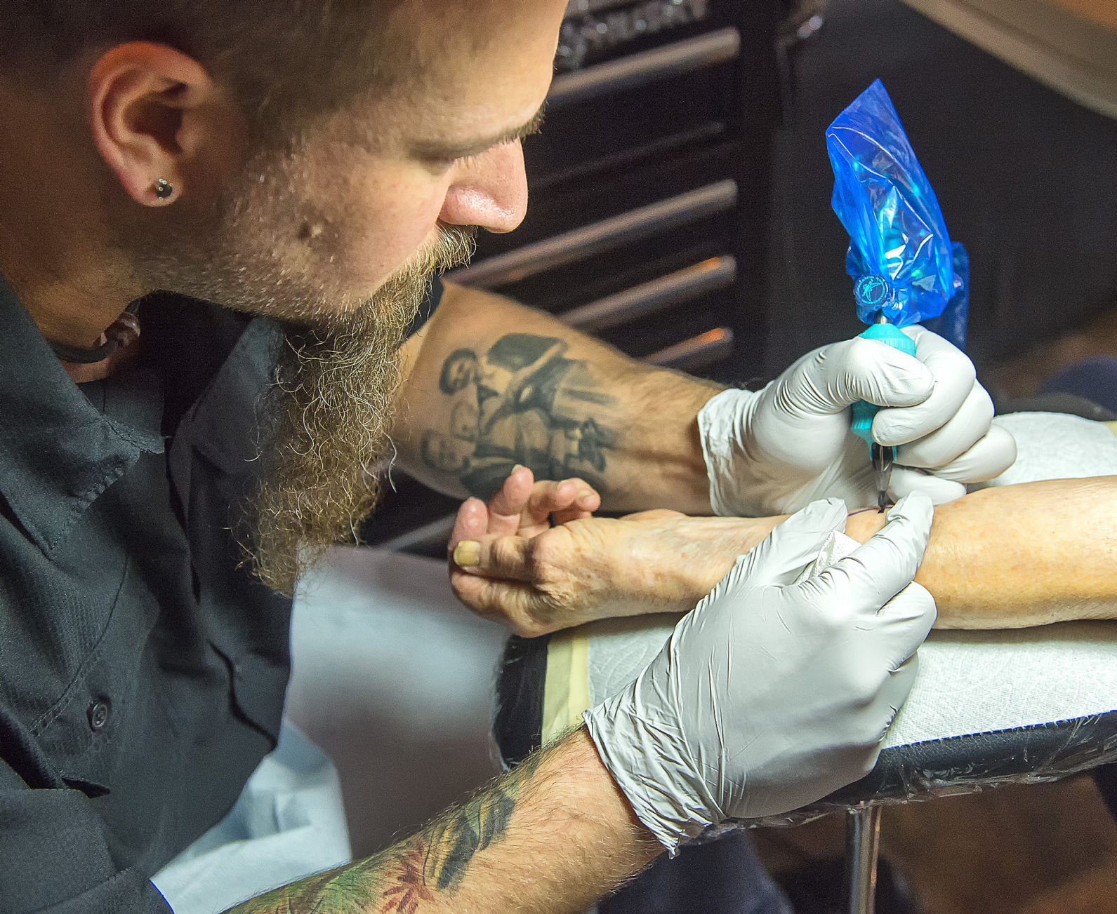 Photos: Apple tattoo helps raise addiction and mental health awareness