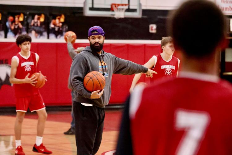 RA Long boys basketball coach leader off and off the court