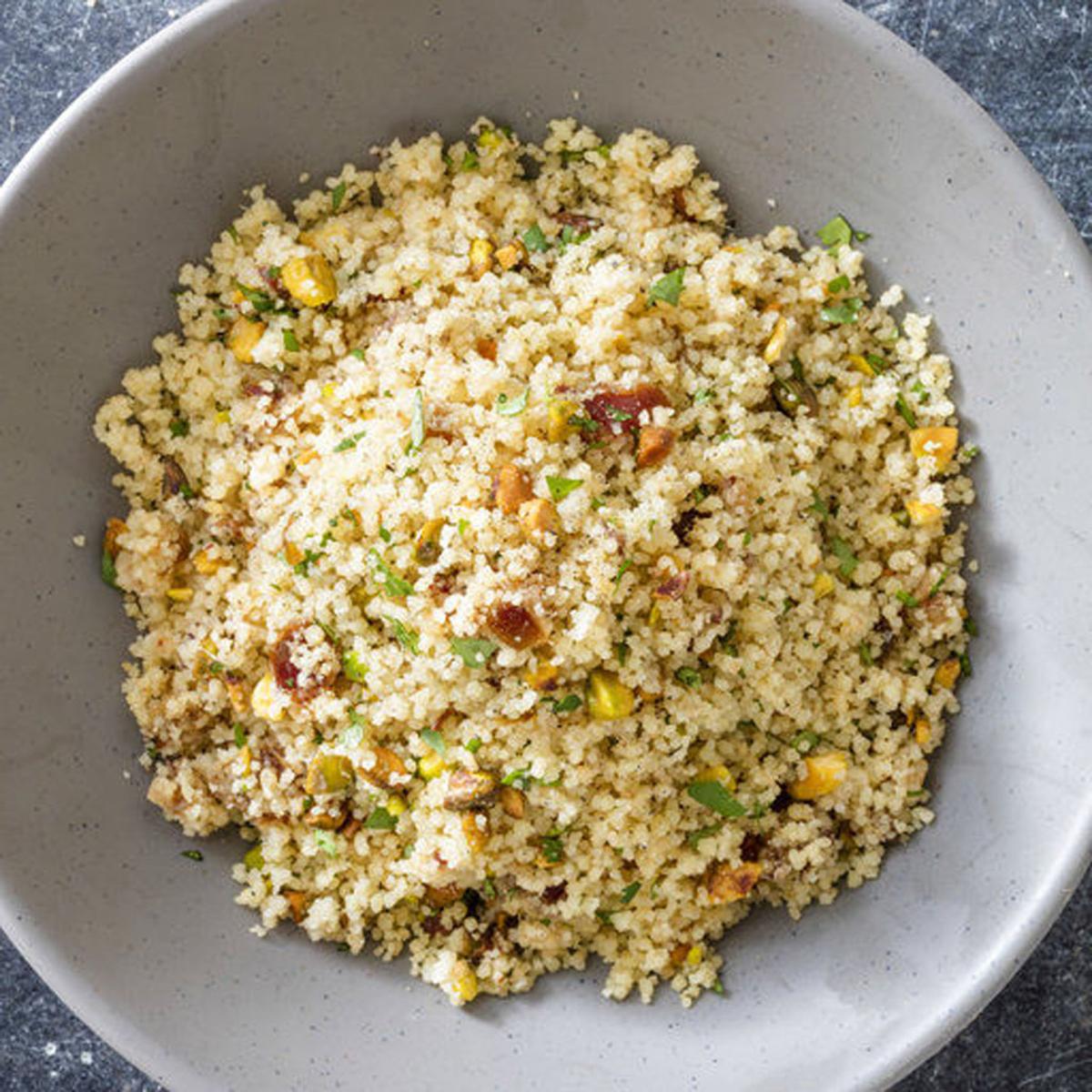 Toasting couscous grains and using broth deepens the flavor