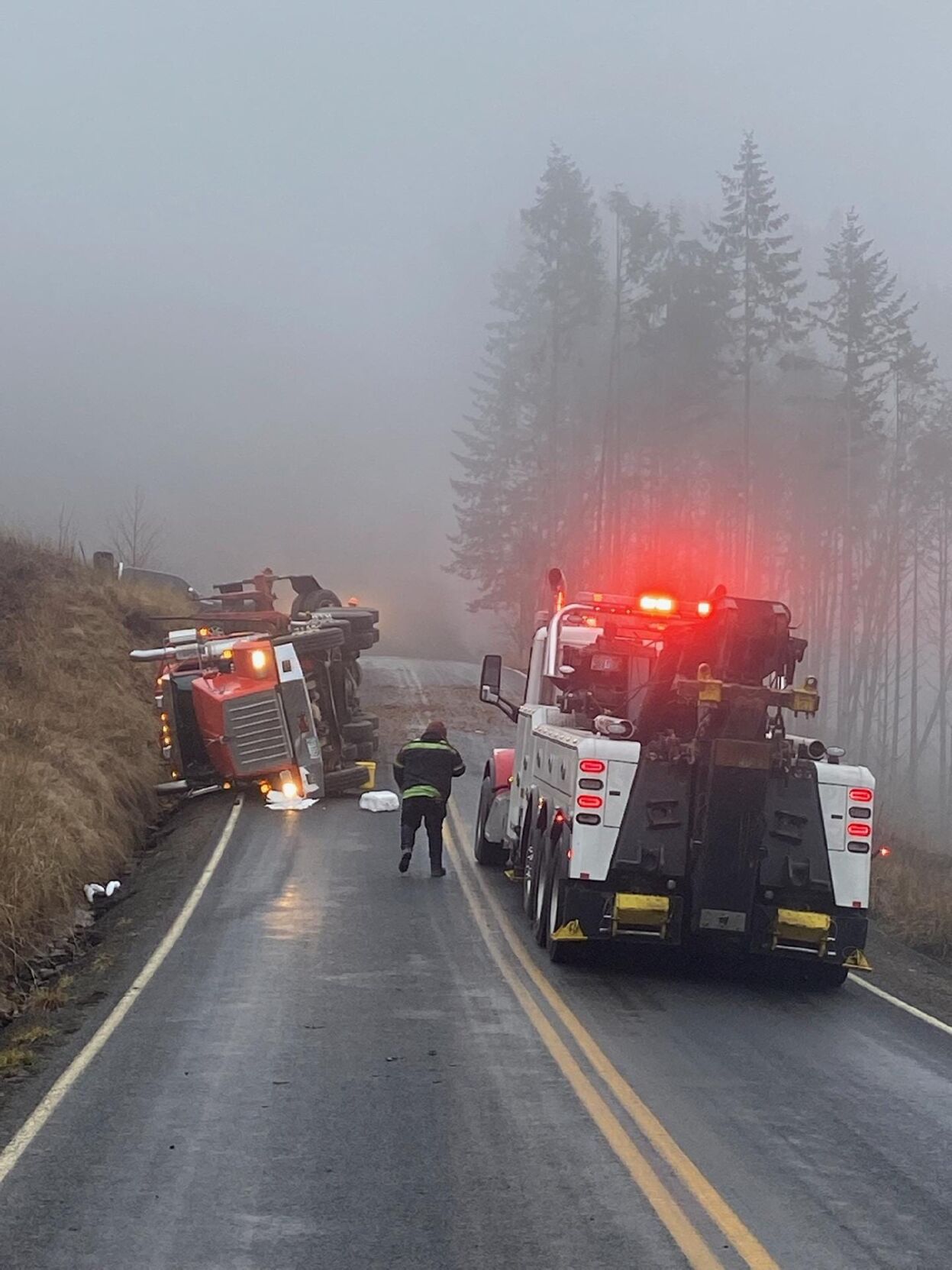 UPDATE Road reopens after log truck rollover Tuesday morning