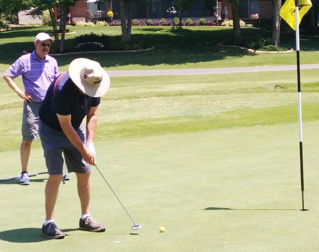 Village golfers tee off for vision