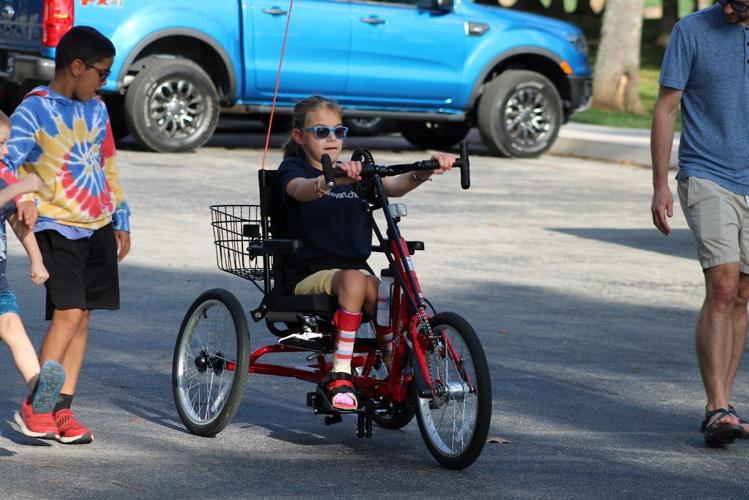 Kiwanis Club of Tellico Village Donates 87th Amtryke to Young Child In Need