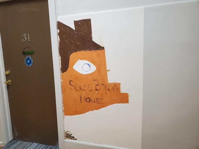 Info sought about mural uncovered at old Grimes School Apartments in