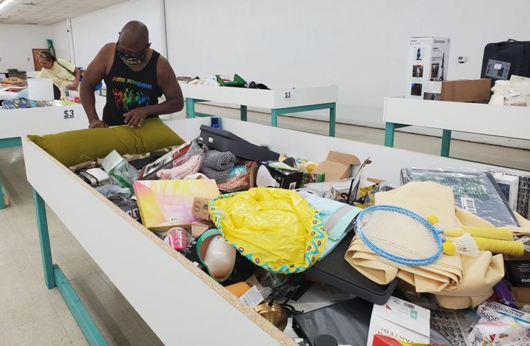 Bargains By the Bin New store has customers digging elbow deep in