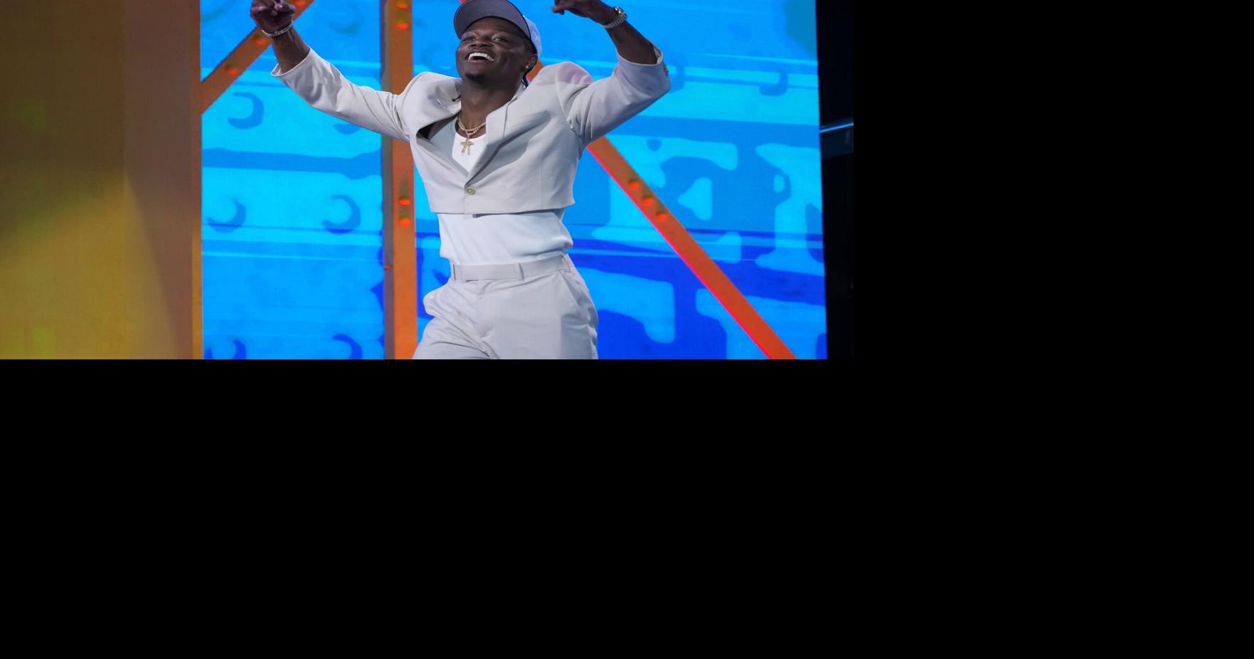 The Titans take receiver Carnell Tate at No. 4, trade up for edge rusher Keldric Faulk