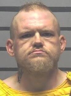 Man accused of arson after setting boxes on fire net to apartments