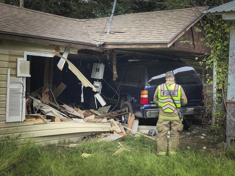 SUV crashes into house, one injured