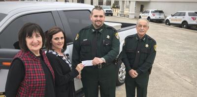 Reserves donate Trail of Lights proceeds to Sheriff's Office