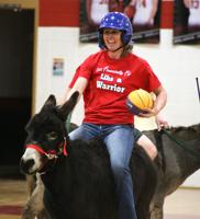 Locals try their skills at Donkey Basketball!