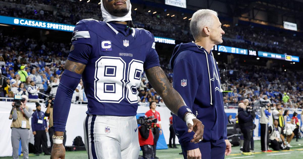 Dallas Cowboys wide receiver CeeDee Lamb leaves the field after suffering a concussion on a second half touchdown attempt against the Detroit Lions at Ford Field in Detroit, Dec. 4, 2025.