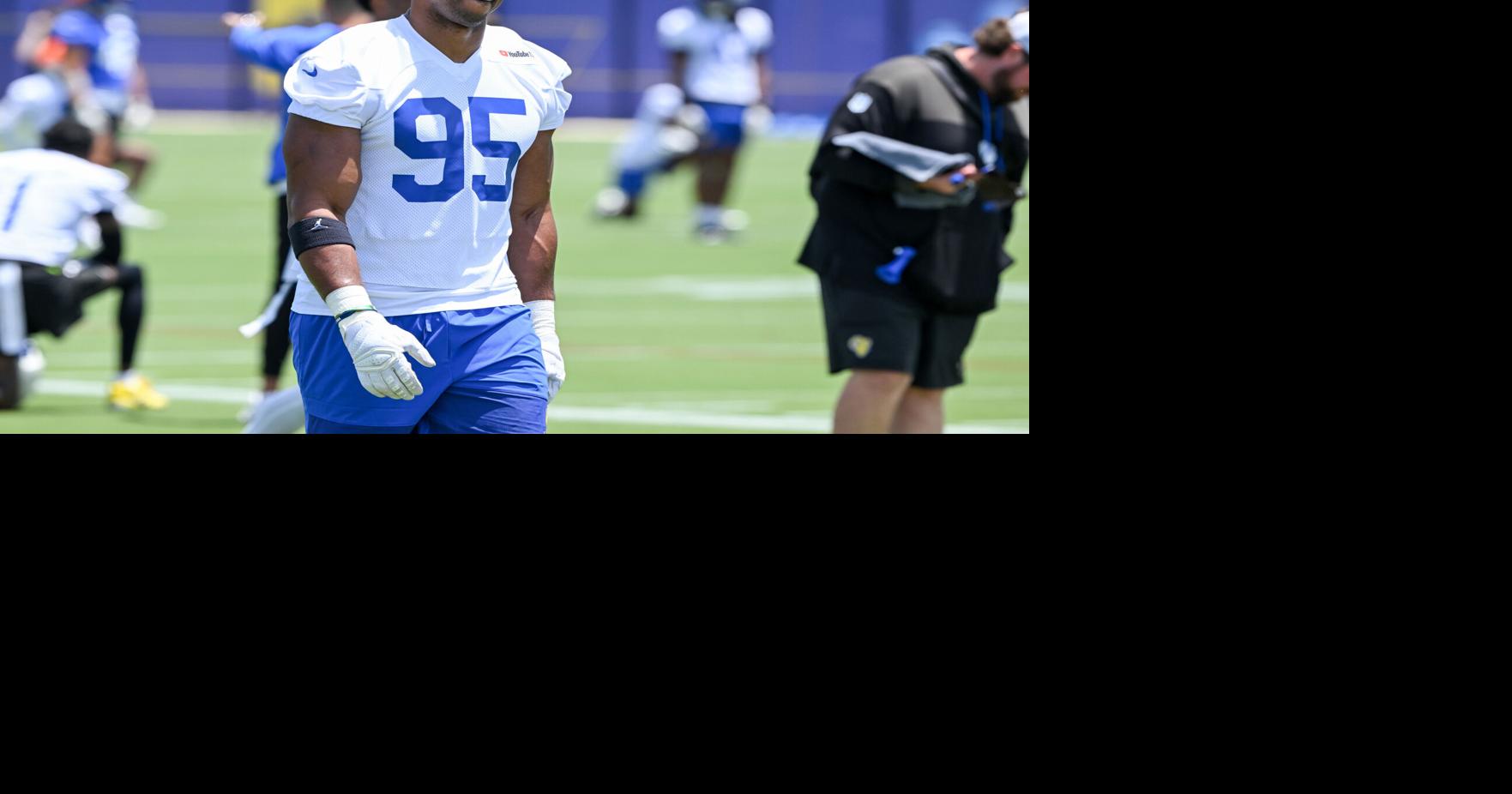 Newly acquired Los Angeles Rams defensive end Myles Garrett walks on the field during an OTA practice June 8, 2026, in Woodland Hills, Calif..