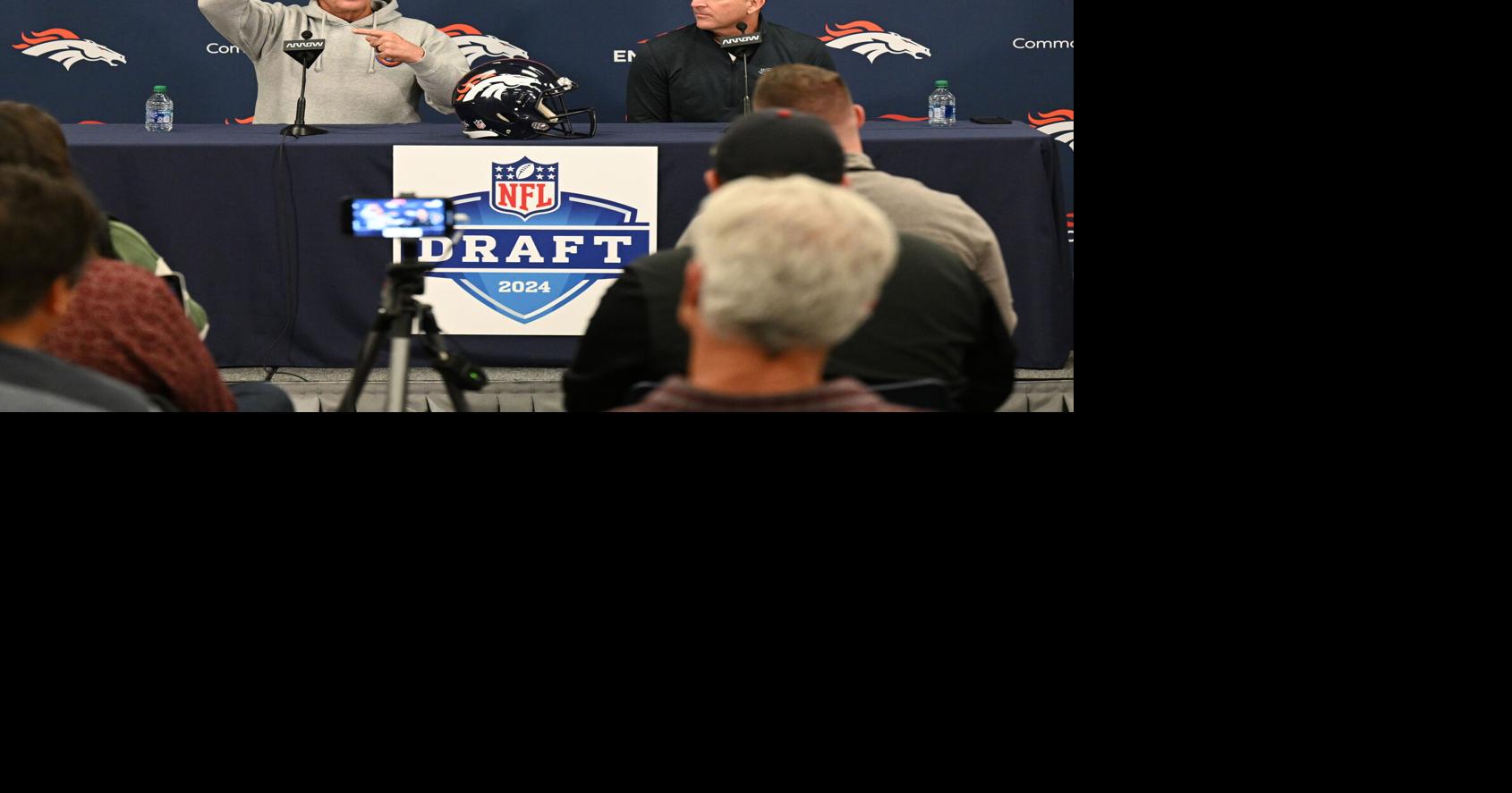 Denver Broncos head coach Sean Payton, left, and general manager George Paton talk to media during a pre-draft press conference on in Englewood, Colo., on April 18, 2024.