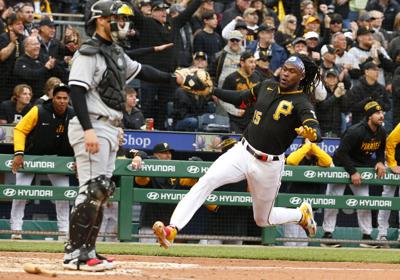 Oneil Cruz of the Pittsburgh Pirates scores on a RBI triple in the fifth inning against the Chicago White Sox during inter-league play on Opening Day at PNC Park on April 7, 2023, in Pittsburgh.