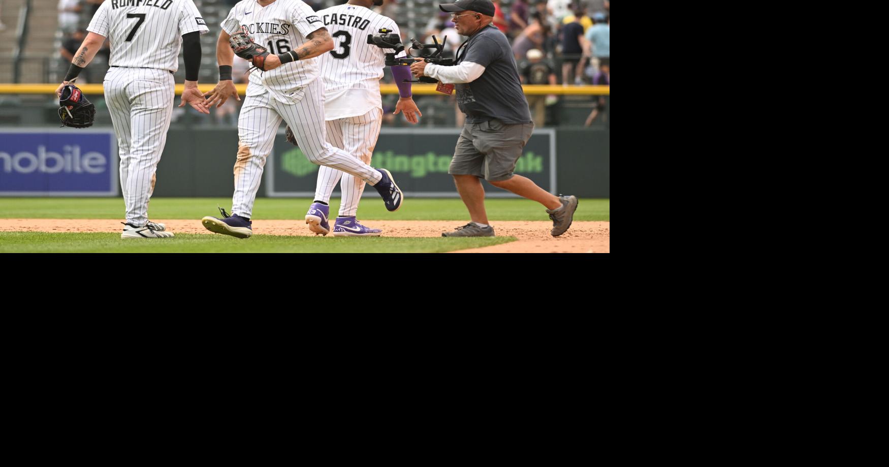 From left, Colorado Rockies first baseman TJ Rumfield, center fielder Cole Carrigg, and second baseman Willi Castro celebrate after an 8-6 win against the Boston Red Sox at Coors Field on Wednesday, June 24, 2026, in Denver.