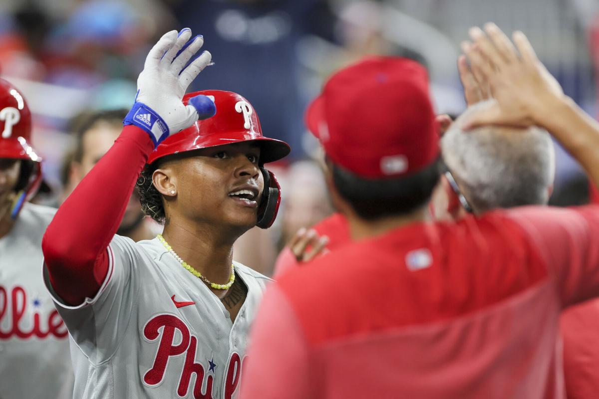 Pache's pinch-hit, 2-run HR rallies Phils past Marlins for record