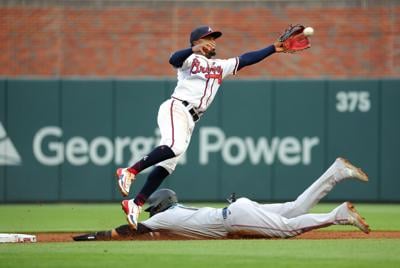 Miami Marlins' Yuli Gurriel celebrates the last out of the third