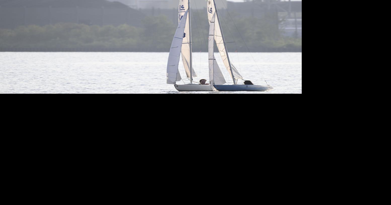 Social media influencer Mason Branstrator, left, and his girlfriend Victoria Duenes navigate 2.4 sailboats, made for adaptive sailing, on Lake Superior off of Park Point Tuesday, July 28, 2026, in Duluth, Minn..