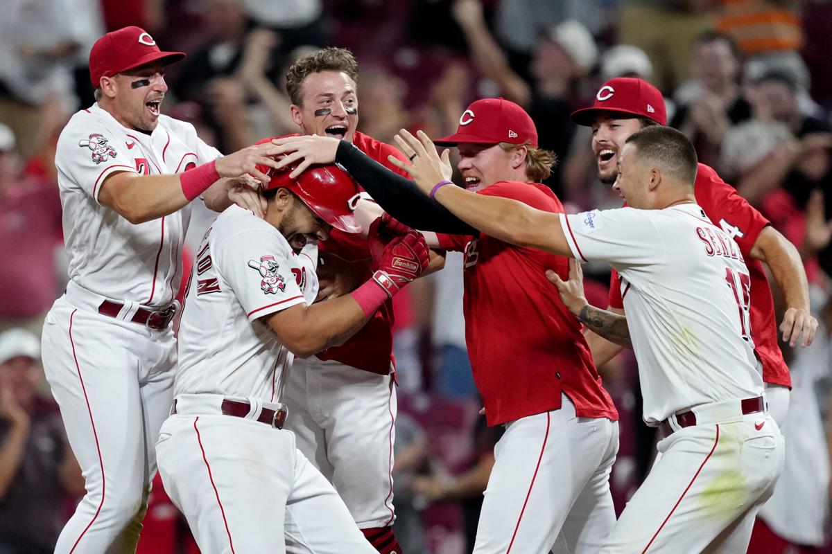 Cincinnati Reds' Christian Encarnacion-Strand (33) gestures as he