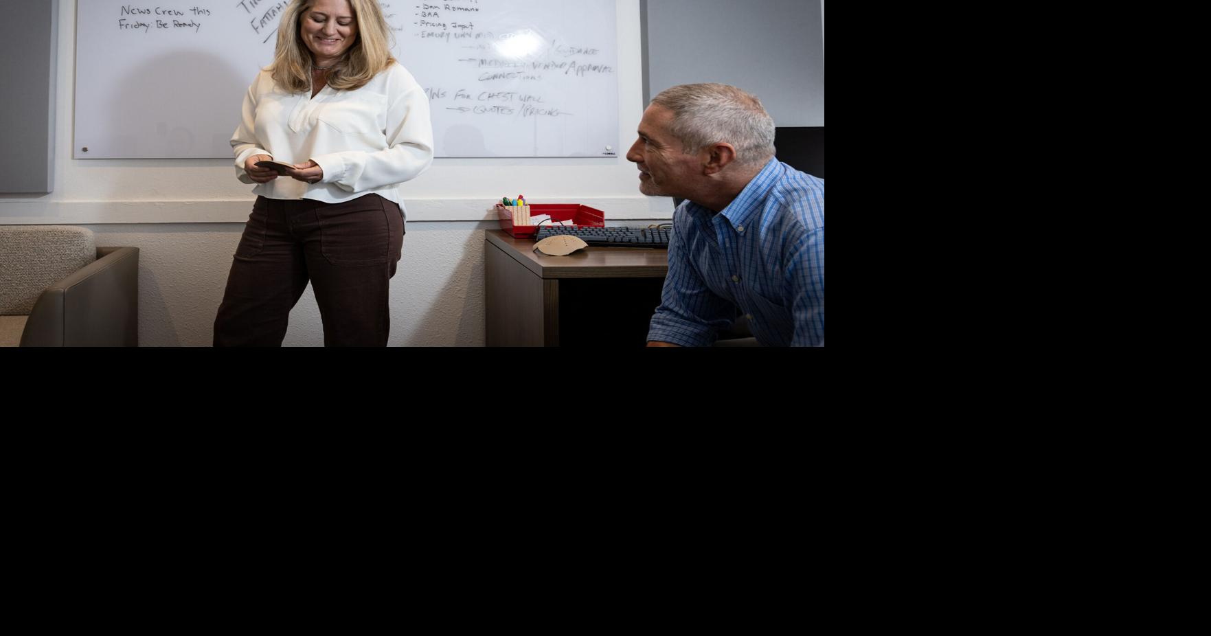 Nancy Hairston, MedCAD president and CEO, looks at a cranial implant with Alan Klompus, senior product manager, in their office on Sept. 12, 2025, in Dallas.