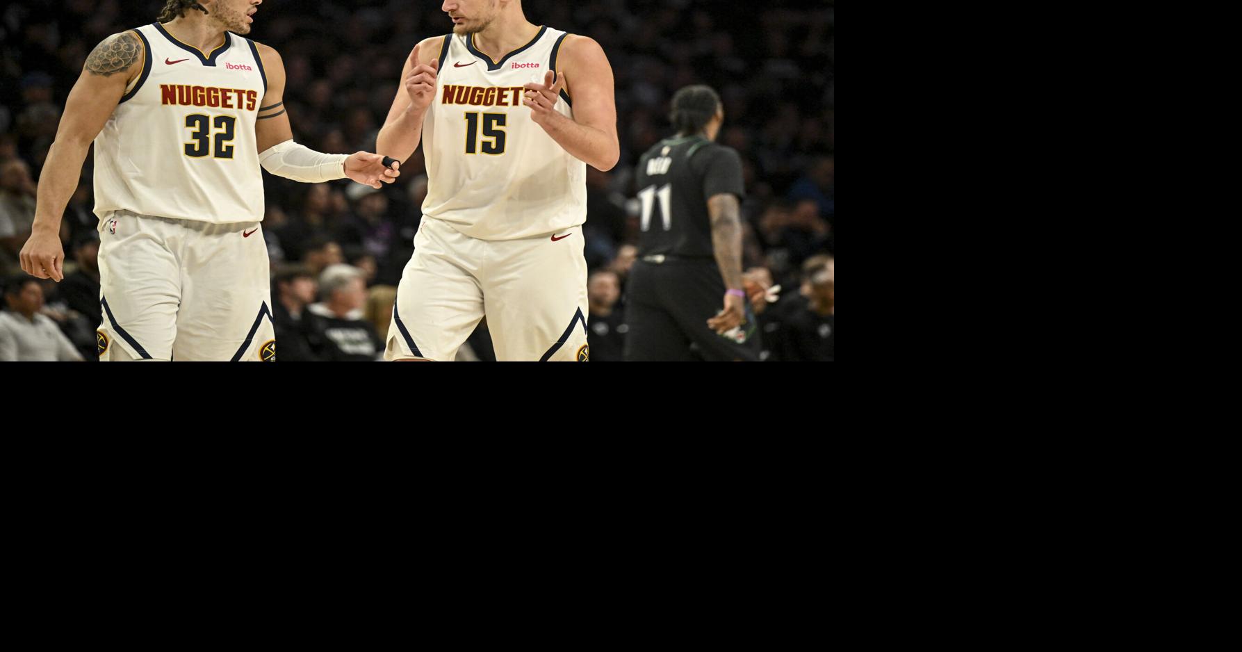 Aaron Gordon and Nikola Jokic of the Denver Nuggets strategize during the second quarter of game four of their NBA Playoffs series against the Minnesota Timberwolves at the Target Center in Minneapolis, Minnesota on Saturday, April 25, 2026.