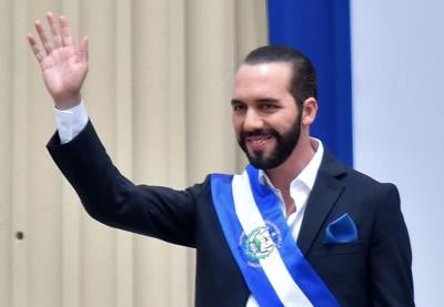 El Salvador's president, Nayib Bukele, waves during his inauguration ceremony at Gerardo Barrios Square outside the National Palace in downtown San Salvador, on June 1, 2019.