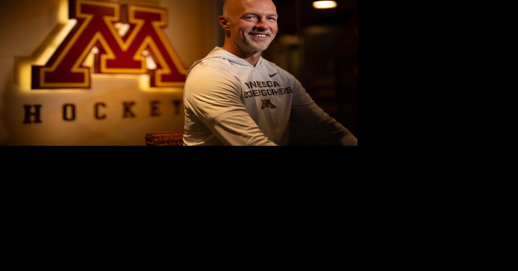 Minnesota Gophers men's hockey coach Brett Larson, sitting outside the team's locker room in 3 M Arena at Mariucci in Minneapolis, is excited to lead a blue-blood program.