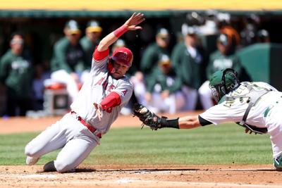 Angels score 11 runs in third inning en route to routing Athletics