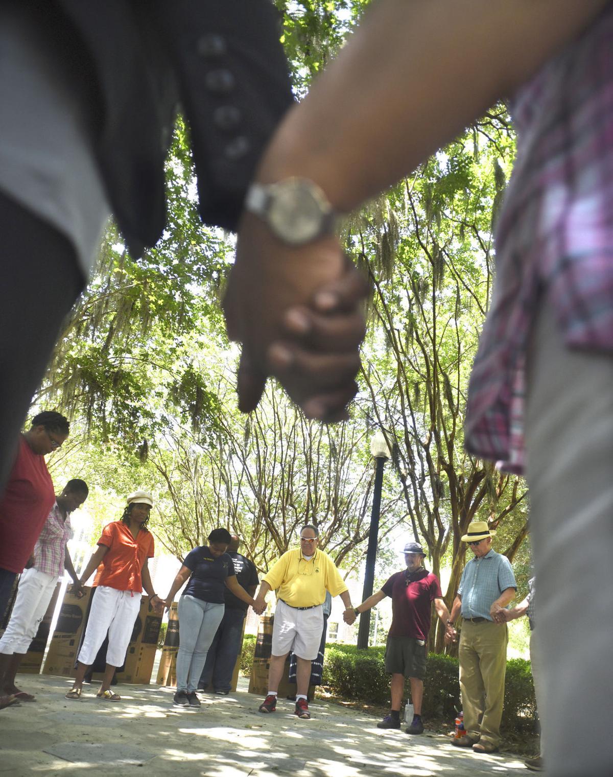 Demonstrators Protest Caroline Small Shooting At Courthouse