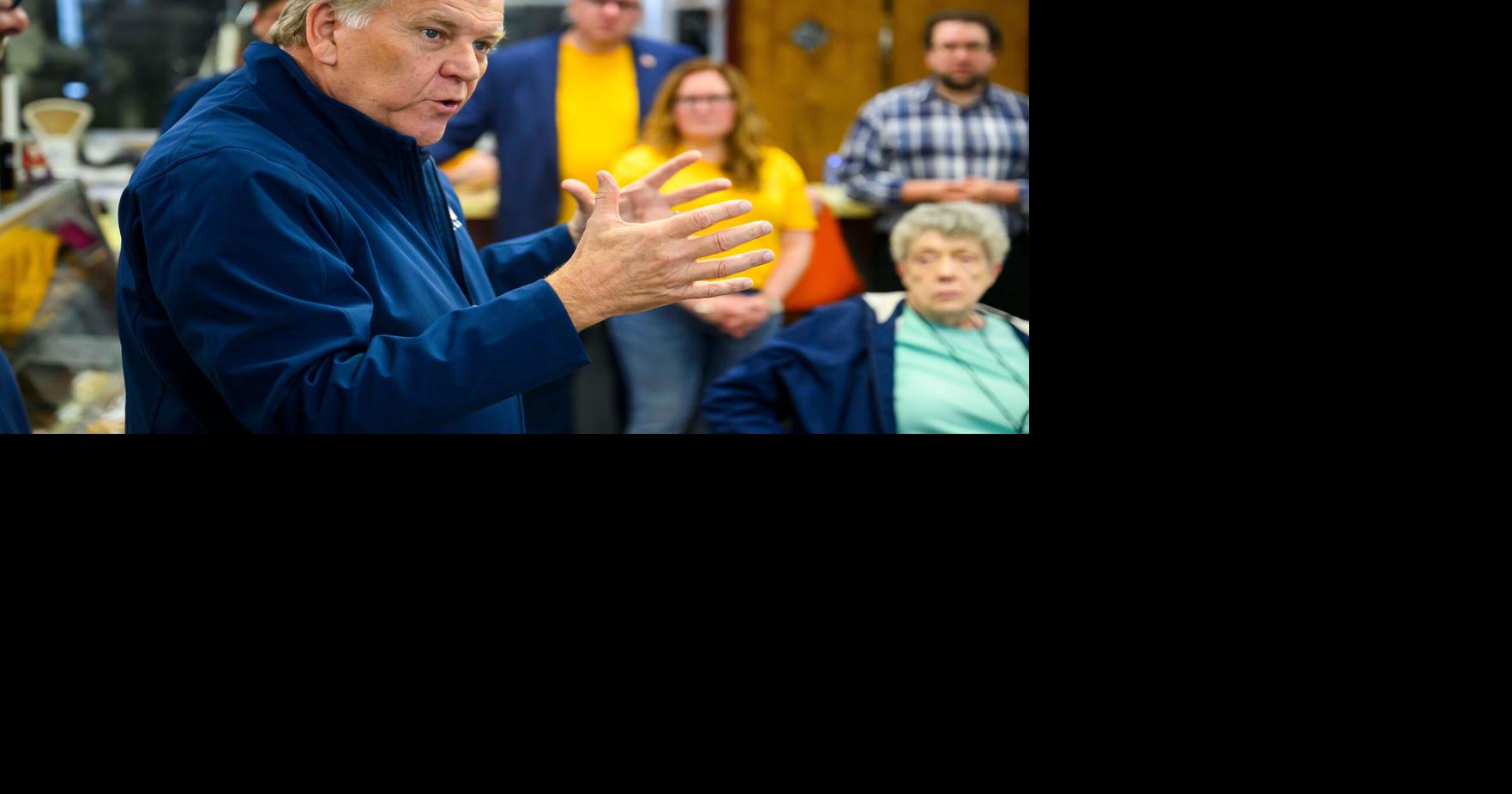 Mike Rogers, a candidate for U.S. Senate, speaks with volunteers before heading out for a day of door-to-door campaigning on May 16, 2026, at Elliott's Bakery in Trenton, Michigan.