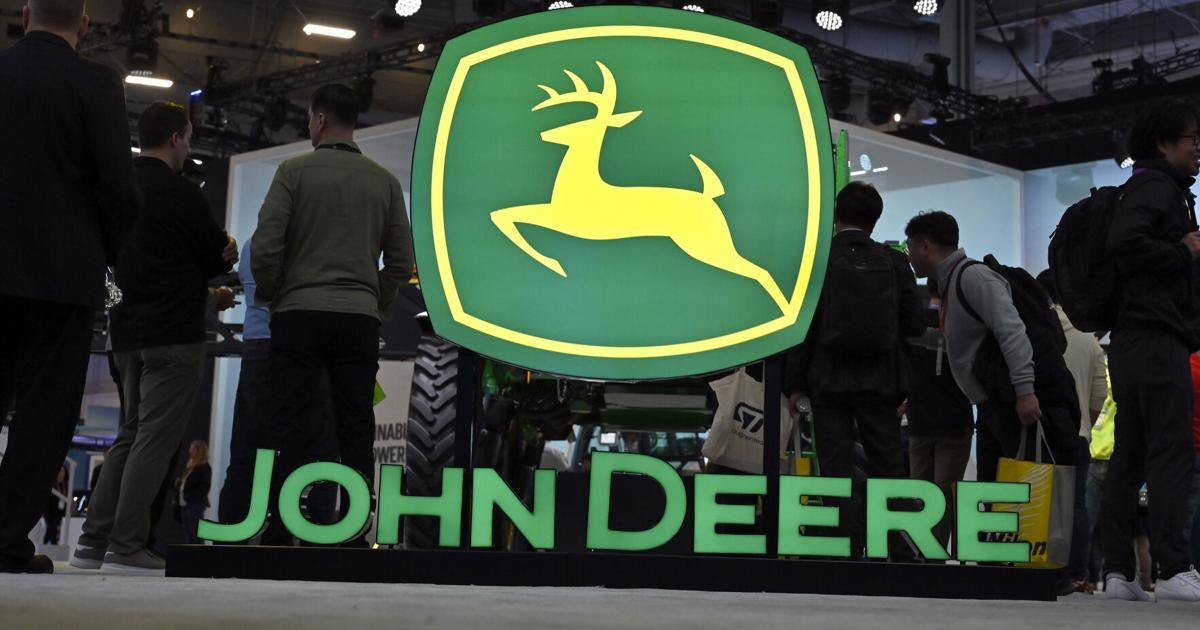 John Deere booth signage is displayed at CES 2023 at the Las Vegas Convention Center on Jan. 6, 2023, in Las Vegas.