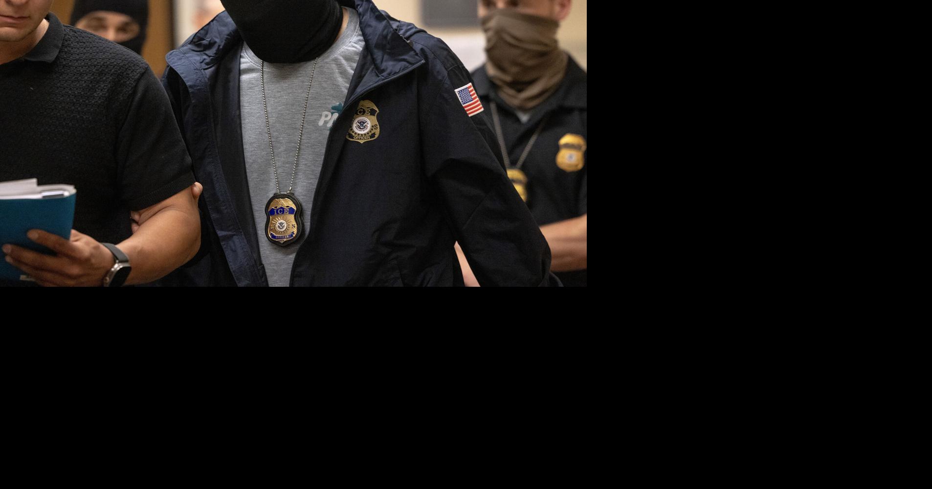 An ICE agent detains an immigrant at Seattle Immigration Court on June 4, 2025, in Seattle.