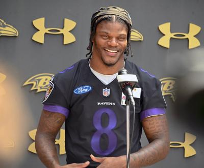 Baltimore Ravens quarterback Lamar Jackson answers questions after organized team activities at the Under Armour Performance Center in Owings Mills on Wednesday, May 24, 2023. Jackson spoke glowingly of coordinator Todd Monken's offense, saying,“ I’ m l...