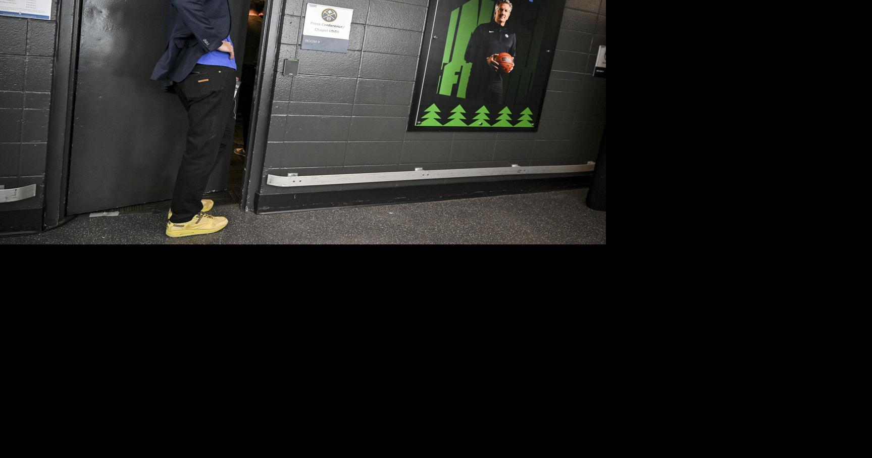 Team President Josh Kroenke listens from outside the door as head coach David Adelman of the Denver Nuggets speaks to members of the media after the Minnesota Timberwolves’ 110-98 Game 6 NBA Playoffs series win at the Target Center in Minneapolis on Thursday, April 30, 2026.