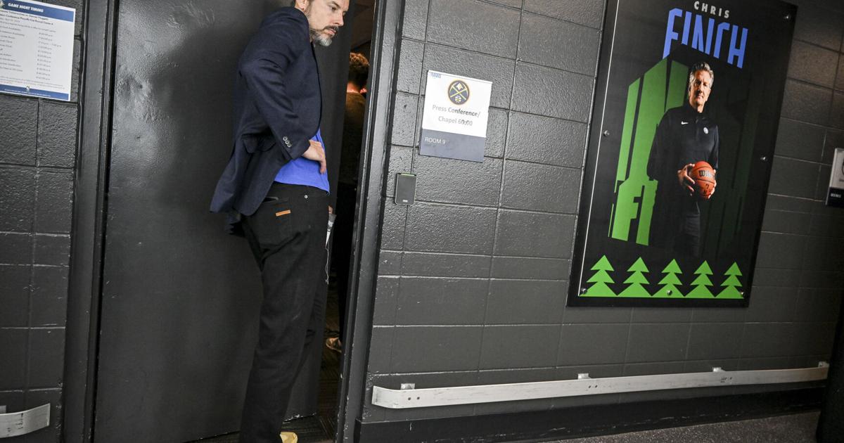 Team President Josh Kroenke listens from outside the door as head coach David Adelman of the Denver Nuggets speaks to members of the media after the Minnesota Timberwolves’ 110-98 Game 6 NBA Playoffs series win at the Target Center in Minneapolis on Thursday, April 30, 2026.